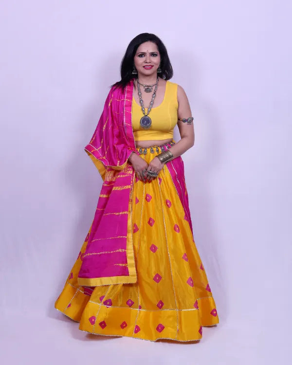 Yellow Bandhej Chaniya Choli with Pink Dupatta & Blouse Piece